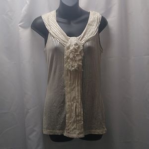 The limited cream sleeveless blouse